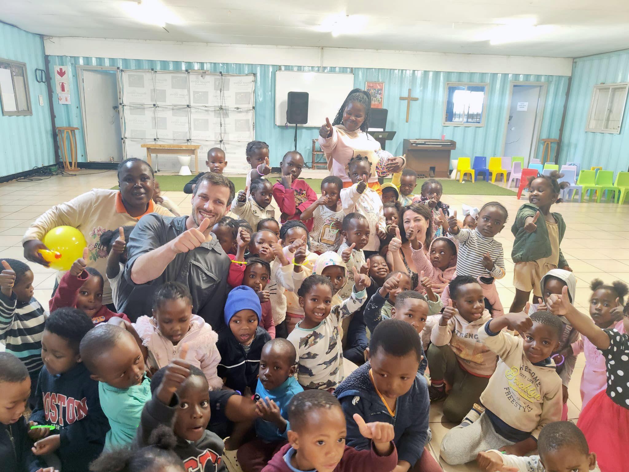 Community centre staff and children participating in trauma-informed abuse prevention education